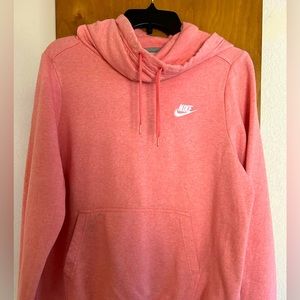 Salmon colored Nike hooded sweatshirt.